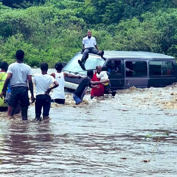 Eleven passengers were saved from rising floodwaters, but the operation claimed the life of a brave rescuer.